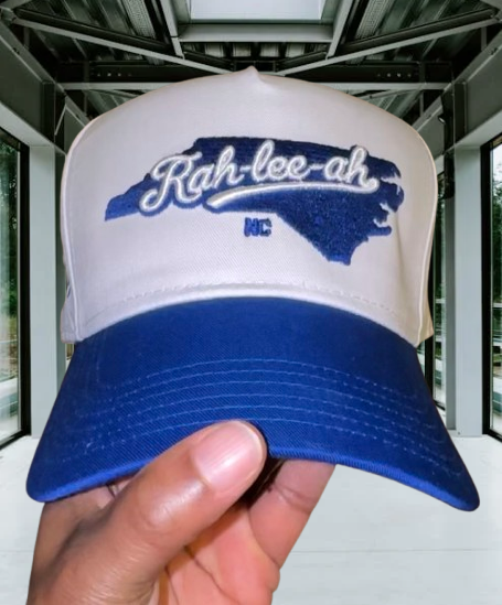 White and blue cap with 'Rah-lee-ah' 